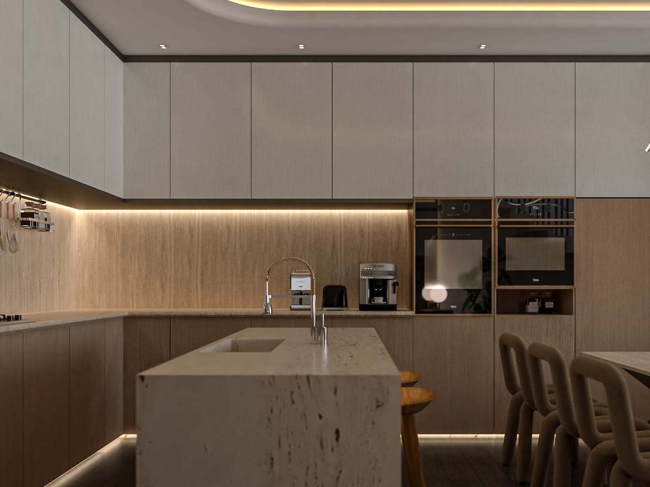 Modern kitchen with a large island, white quartz countertop, and warm under-cabinet lighting along light wood cabinets.