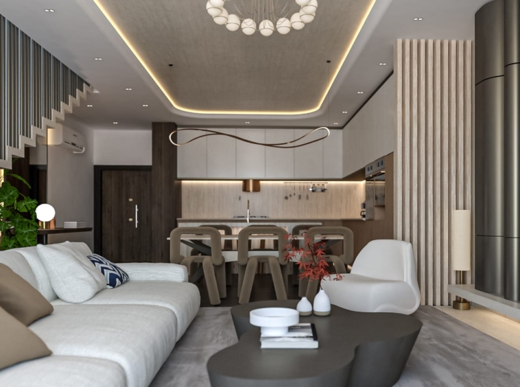 Open-plan living area with a white sofa, sculptural coffee table, and a dining table, with a modern kitchen in the background.