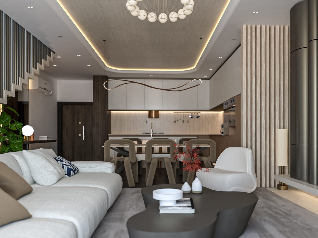 Open-plan living area with a white sofa, sculptural coffee table, and a dining table, with a modern kitchen in the background.
