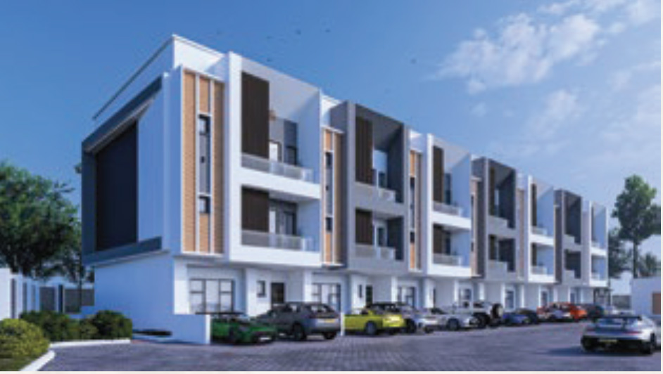 Modern row of white and gray townhouses with balconies, set along a paved parking area under a blue sky.